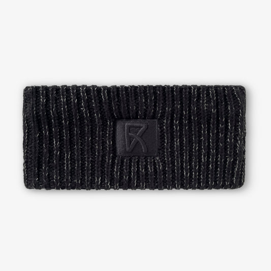 Stickat svart reflexpannband med brodyr, sedd framifrån.